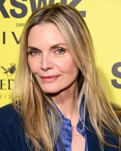 Michelle Pfeiffer in elegant tailored suit with flared pants