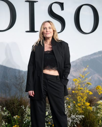 Mika Simmons wearing a pinstriped blazer over black ensemble