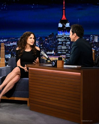 Minnie Driver modern black dress with youthful charm