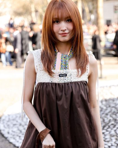 MOMO in soft brown dress with crochet detailing at neckline