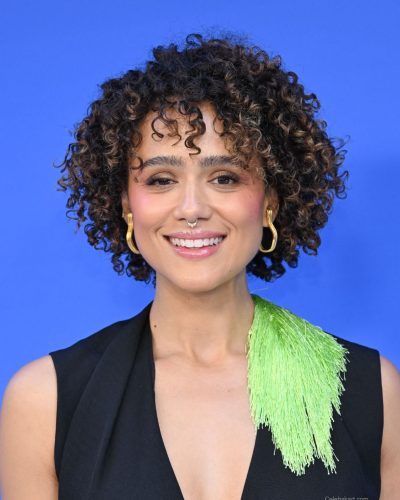 Nathalie Emmanuel in deep V-neck black top with fringe detail