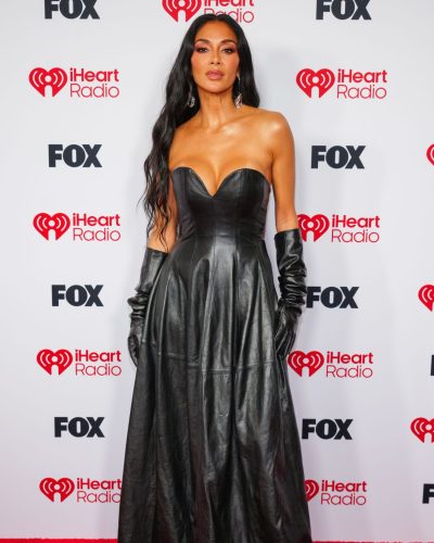 Nicole Scherzinger fitted black leather gown with flowing skirt