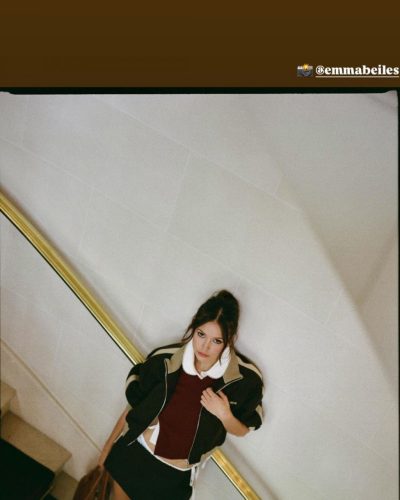 Nina Dobrev color-block jacket with burgundy top and black mini skirt