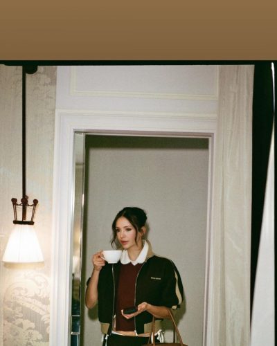 Nina Dobrev brown leather handbag with color-block jacket and mini skirt