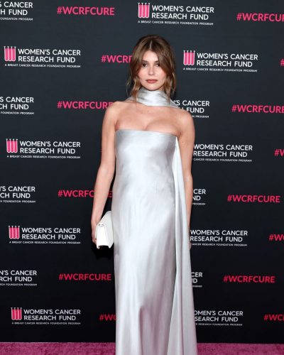 Olivia Jade fitted silver gown hugging her silhouette