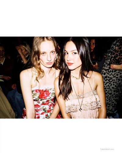 Olivia Rodrigo light pink dress featuring dynamic feather details