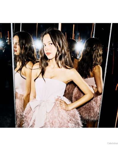 Olivia Rodrigo playful feathered skirt paired with beige heels