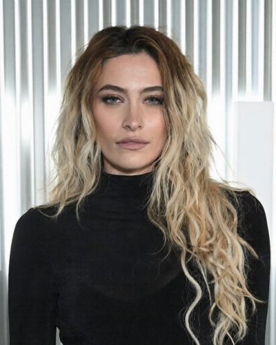 Paris Jackson fitted black dress with minimalist sandals