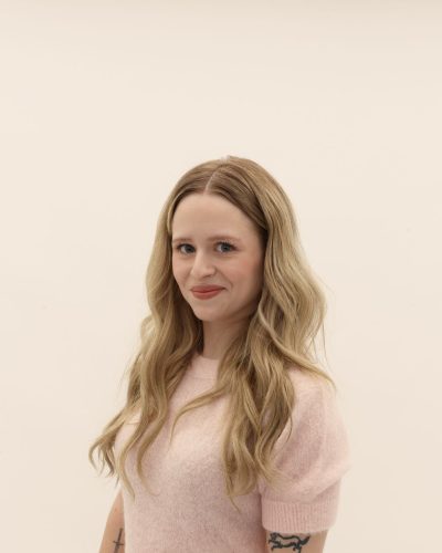 Peyton Elizabeth Lee in vibrant denim jacket with playful motifs