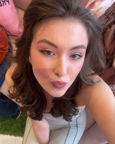 Rachel Pizzolato sophisticated burgundy dress with flowing hemline