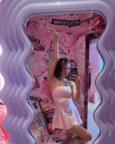 Rachel Pizzolato flowing burgundy gown with stylish cutout