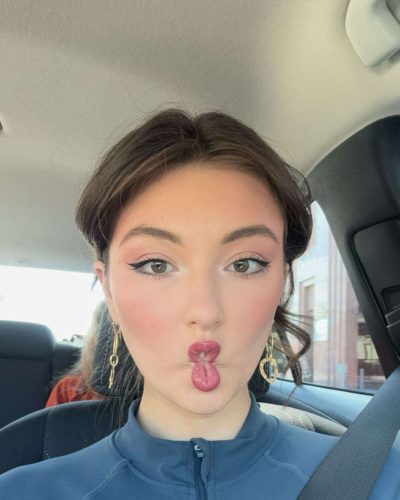 Rachel Pizzolato graceful burgundy dress complementing her complexion