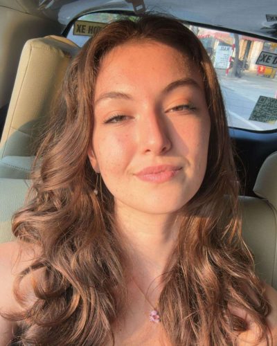 Rachel Pizzolato sophisticated burgundy dress with flowing hemline