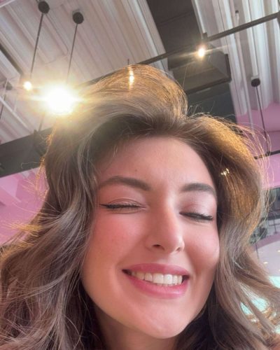 Rachel Pizzolato bold burgundy gown with unique design details