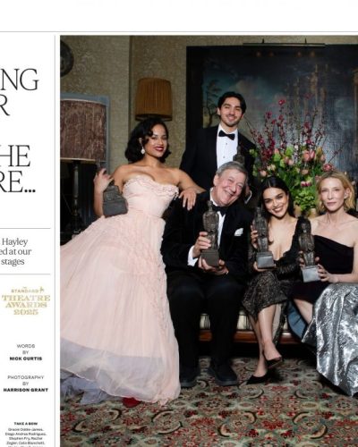 Rachel Zegler black lace dress complemented by statement earrings