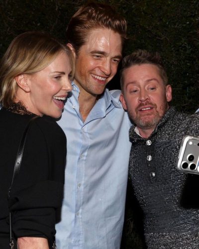 Robert Pattinson in casual black trousers paired with light blue shirt