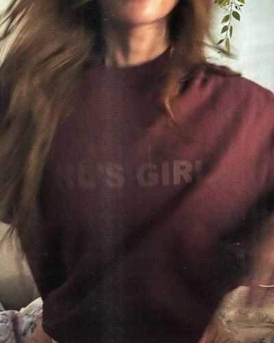 Sarah Shahi in pink bikini top and maroon sweater