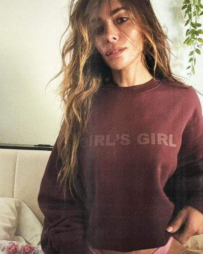 Sarah Shahi wearing flirty pink bikini under maroon sweater