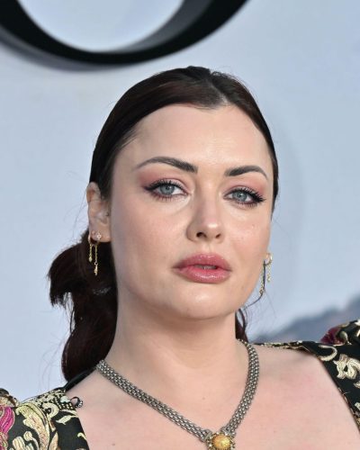 Shona McGarty in a green satin gown with a plunging neckline