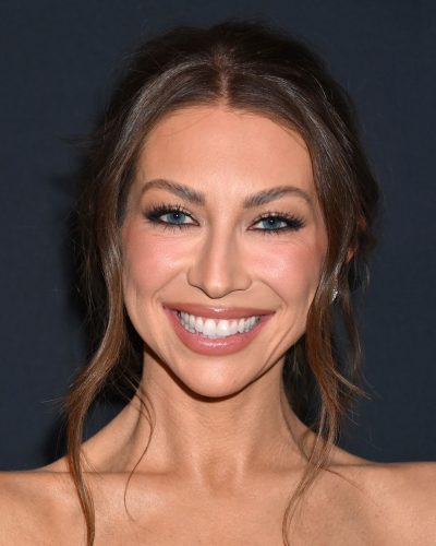 Stassi Schroeder in modern black gown reflecting contemporary fashion trends.