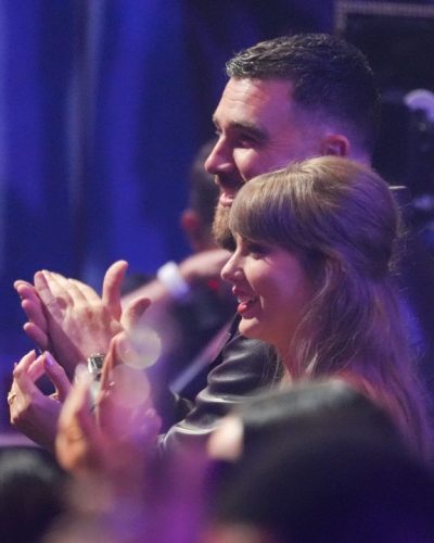 Taylor Swift elegant silver accessories complementing her mint dress.