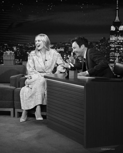 Uma Thurman in cream layered ensemble with textured fabric