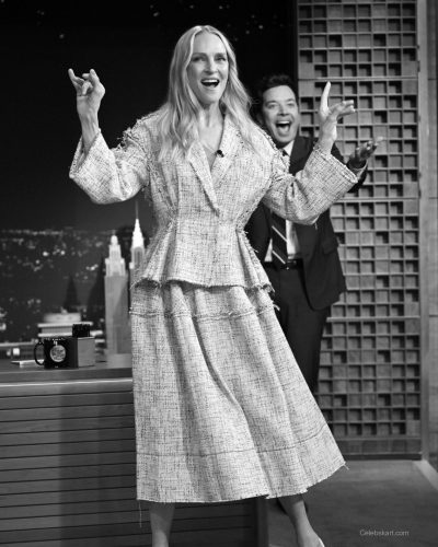 Uma Thurman wearing chic cream jacket and pointed heels