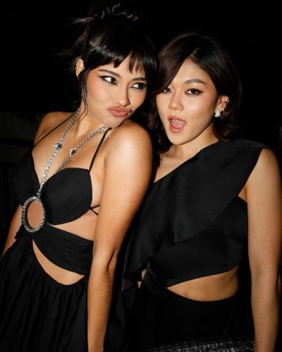 Xochitl Gomez in a fashionable black gown with flowing elements