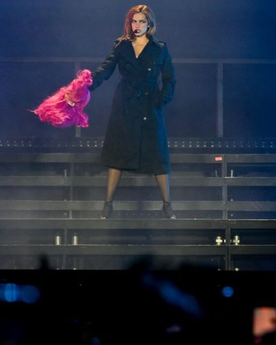 Addison Rae chic purple crop top and fashionable shorts