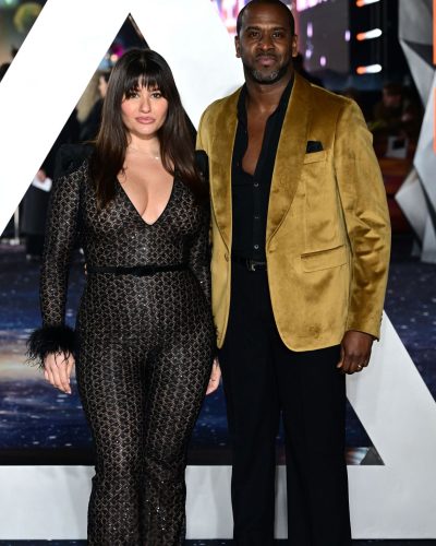 Aida Yahaya black jumpsuit complemented by perfectly styled hair.