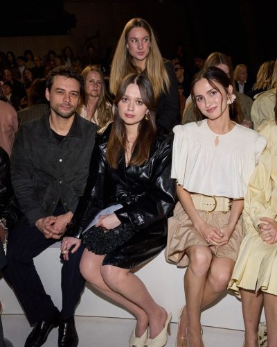 Aimee Lou Wood in chic cream open-toed heels and black coat