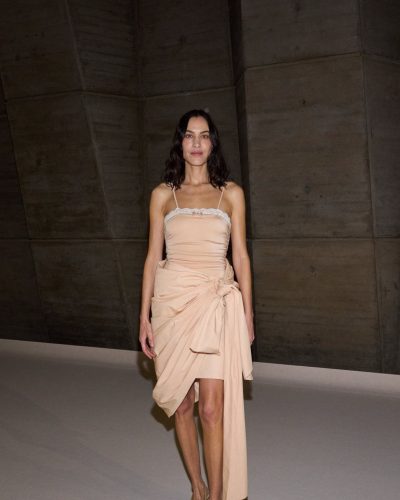 Alexa Chung styled in a minimalist nude gown with draping