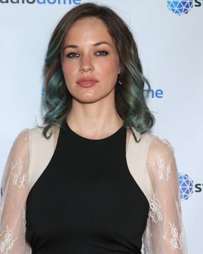 Alexis Knapp stylish black jumpsuit with minimal accessories.