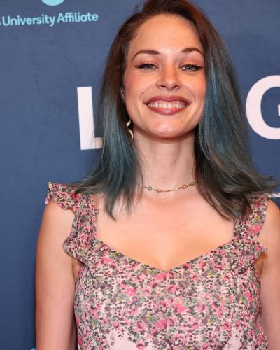 Alexis Knapp wearing a pastel pink gown with delicate floral details