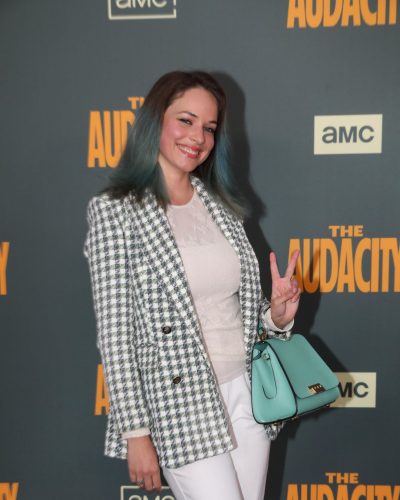 Alexis Knapp flowing hair with blue ends and lace top