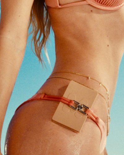 Alexis Ren in peach ribbed bikini with minimal accessories