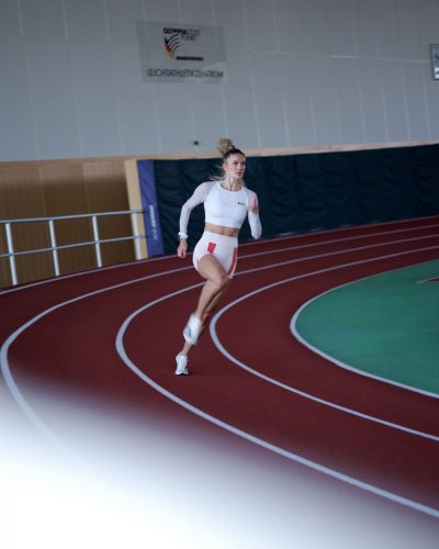 Alica Schmidt in stylish red and white sports apparel