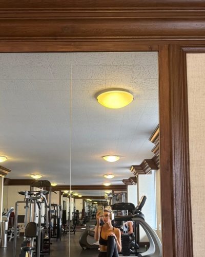 Allison Mason in stylish black bikini enjoying summer vibes.