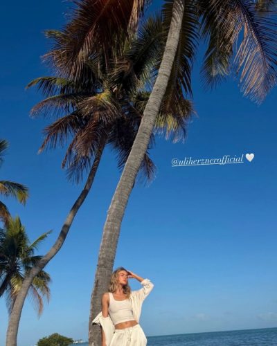 Allison Mason in minimalistic black bikini on Miami beach.