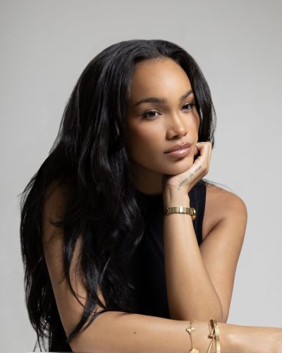 Allyiah Gainer in contemporary black outfit with luxurious gold details