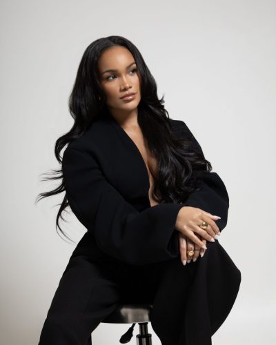 Allyiah Gainer in sophisticated black attire with glamorous gold accents