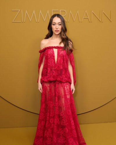 Alycia Debnam-Carey vibrant red dress with soft waves hairstyle