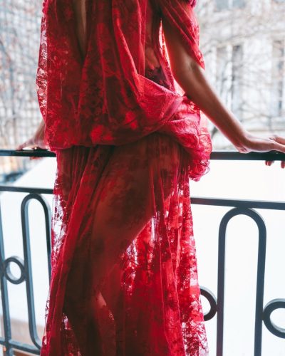 Alycia Debnam-Carey in elegant off-shoulder red lace gown design.