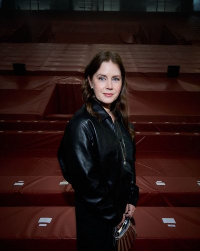 Amy Adams leather bomber jacket with black skirt and accessories