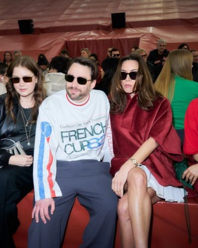 Amy Adams chic sunglasses and black leather bomber jacket