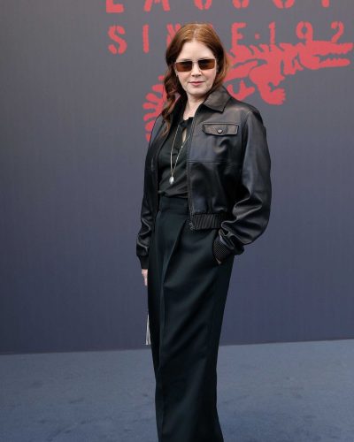 Amy Adams black leather bomber jacket with textured handbag