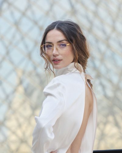 Ana de Armas in a tailored black dress with sleek lines.