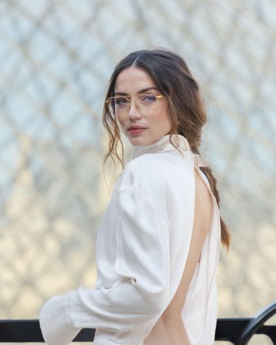 Ana de Armas in a minimalist black dress with daring back detail.