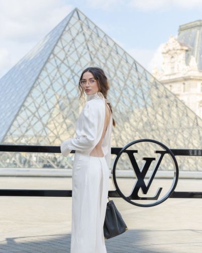 Ana de Armas in a sophisticated black dress with long sleeves.