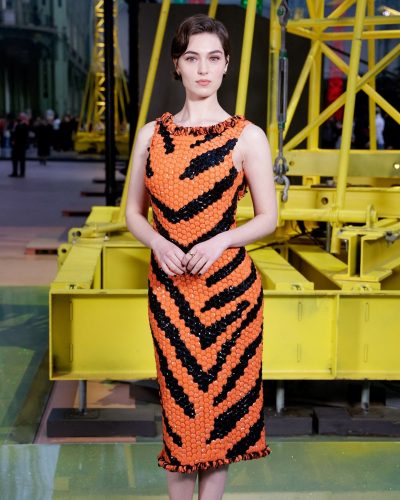 Anamaria Vartolomei in chic black stilettos and orange gown